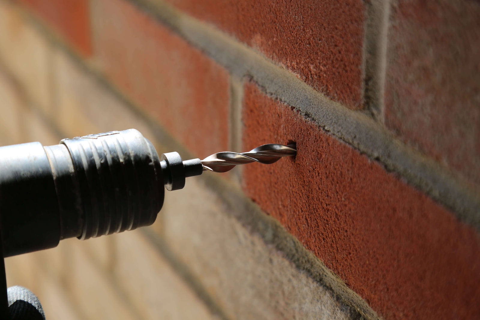 wall tie being installed into a wall