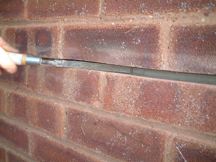 Repointing and finishing trowel for use in crack stitch repairs and repointing