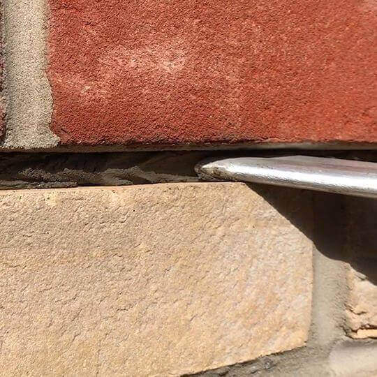 Strucsol HS grout being applied in a mortar joint