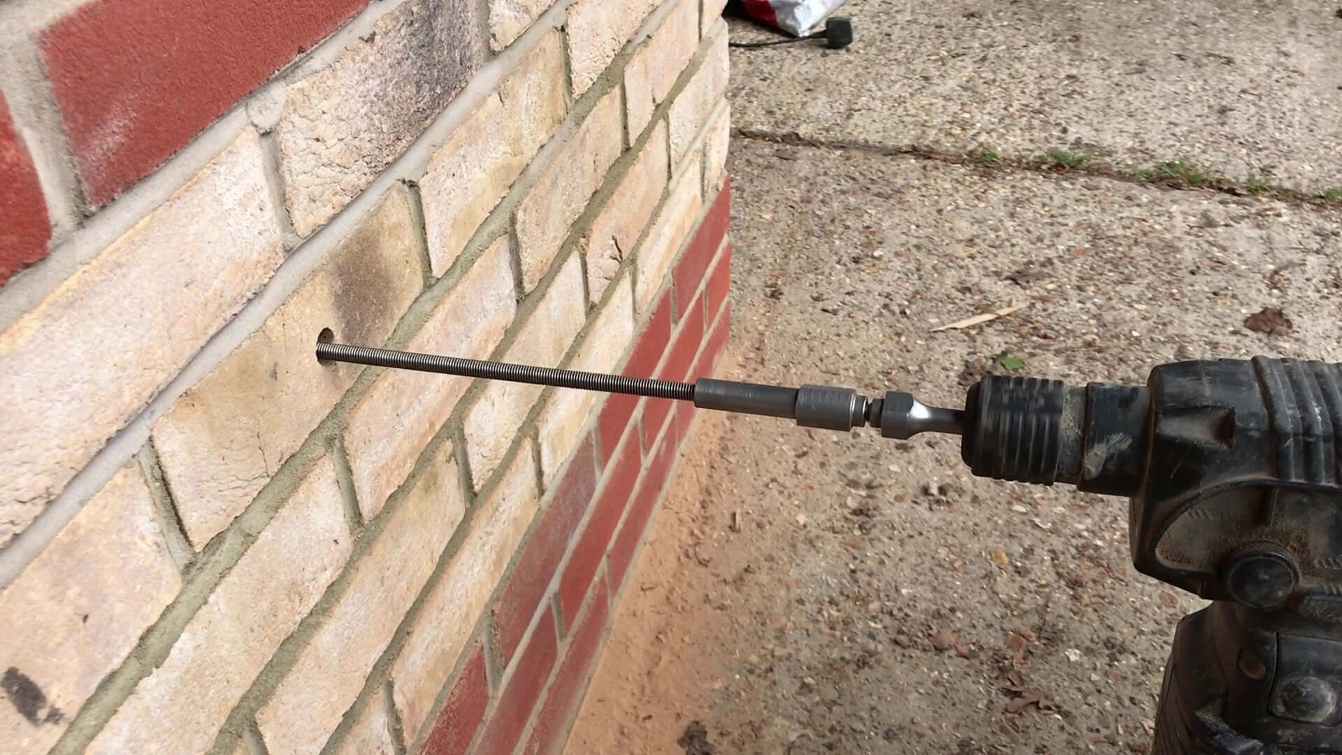 leteral restraint tie being installed into a wall